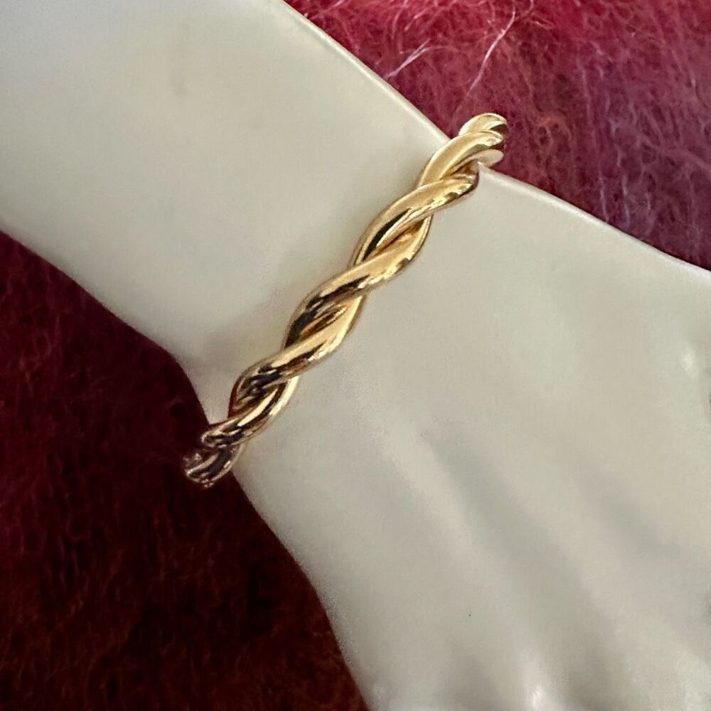 Gold tone twisted open cuff bracelet